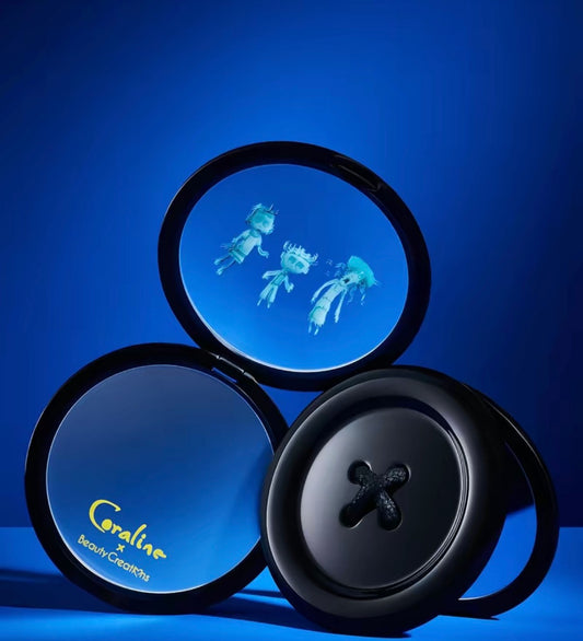 Beauty Creations x Coraline button mirror